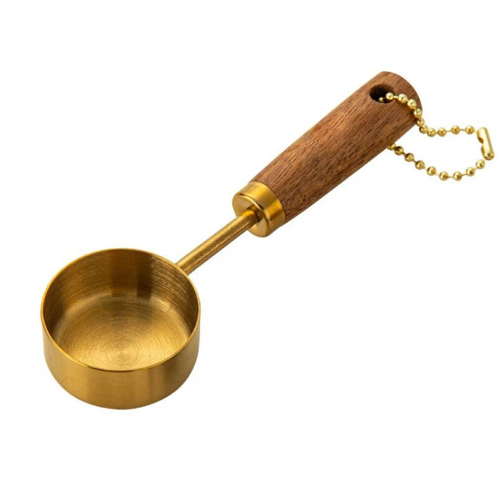 Single gold & wood measuring spoon, stainless steel coffee tool for kitchen.