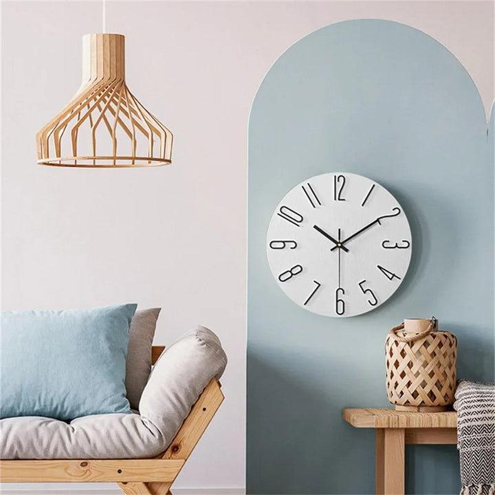 Living room interior with a wooden pendant light, modern white wall clock, and a sofa.
