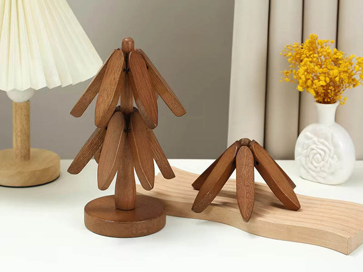 Dark brown wooden tree coaster set on round base – Japandi table decor with warm, rustic tones.