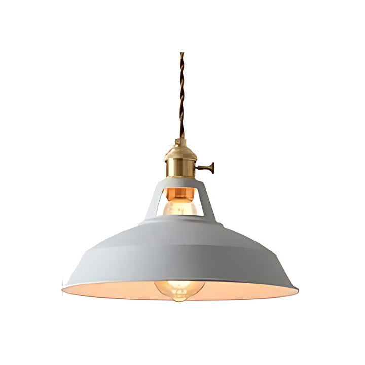 Pendant light with gray shade and brass fixture on a white background