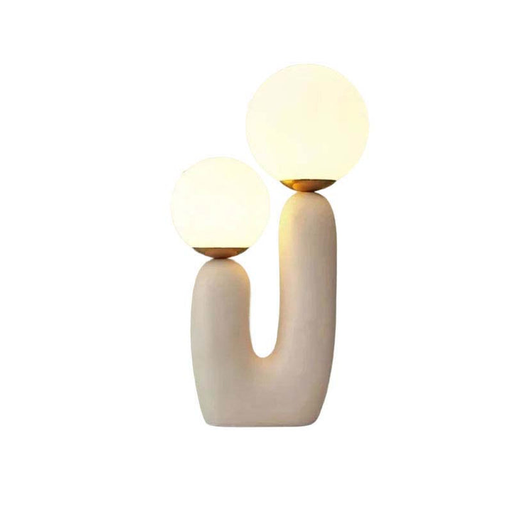 Modern table lamp with two spherical lights on a white background