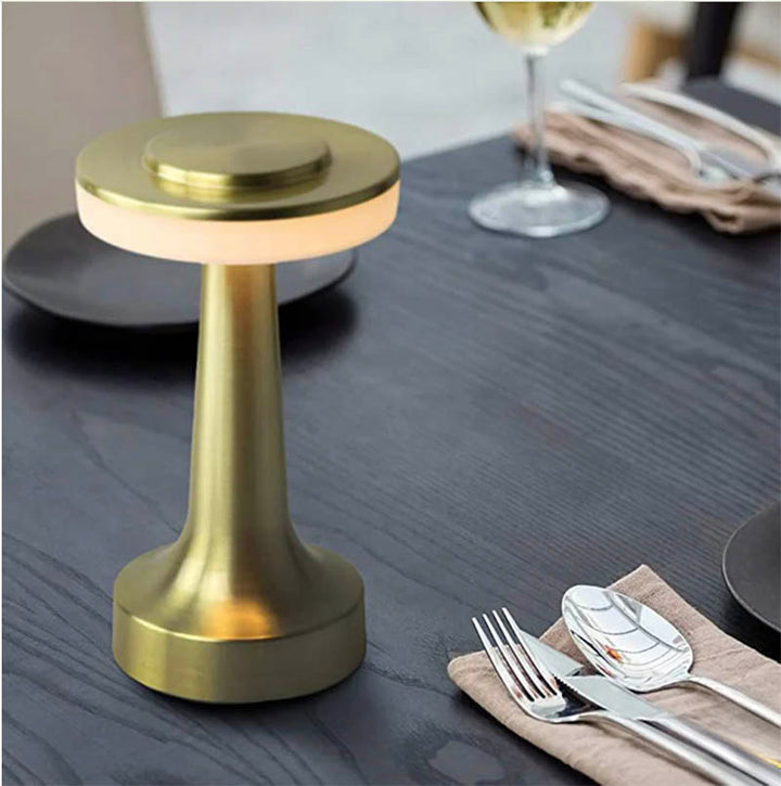 Retro LED table lamp with dimmable light, USB rechargeable design, and a vintage-inspired aesthetic, ideal for bedside or workspace lighting.