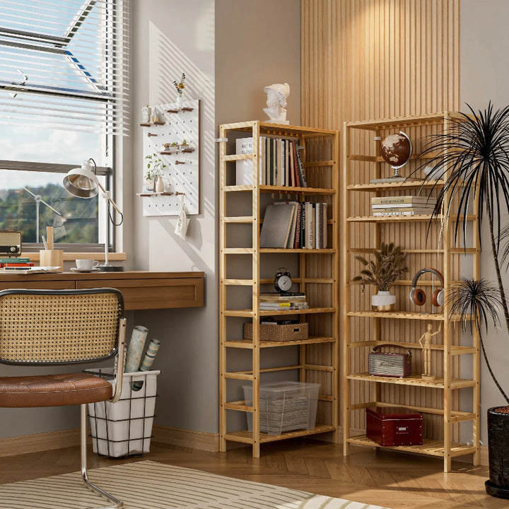 Wooden bookshelves in a room with a desk and decor
