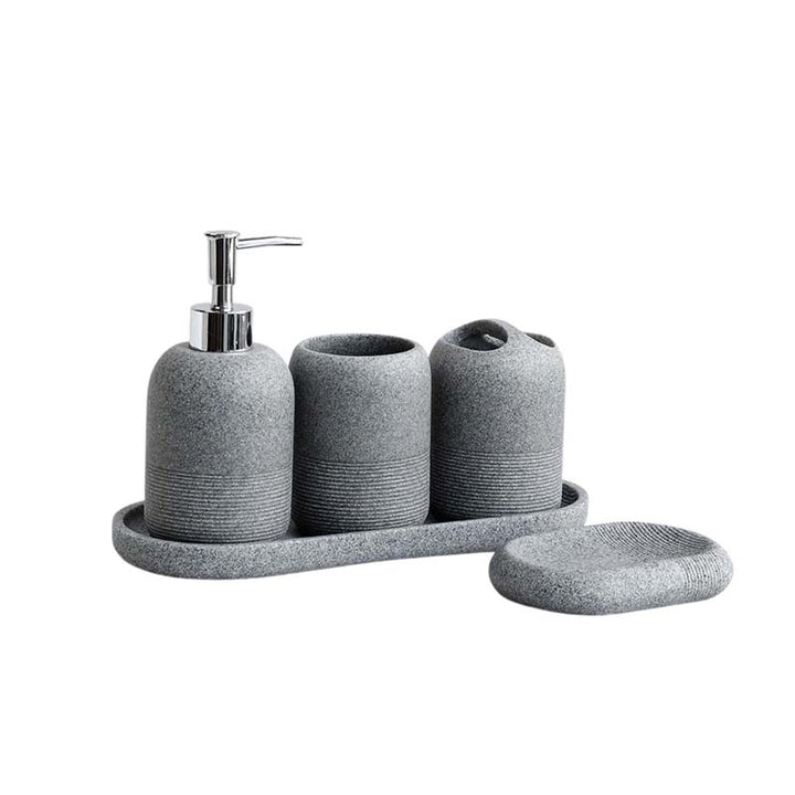 Gray textured bathroom accessory set with a dispenser, cups, and tray on a white background