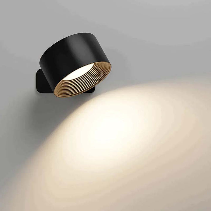 Modern black wall light fixture on a gray background