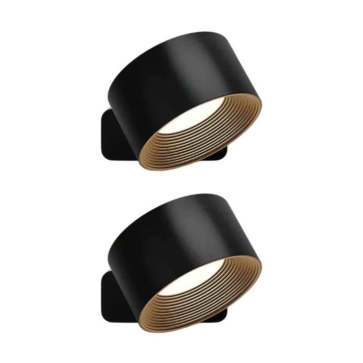 Two black wall lights with gold interior on a white background