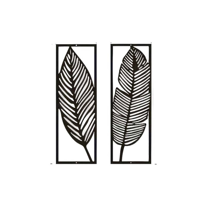 Two black leaf-shaped metal wall art pieces on a white background