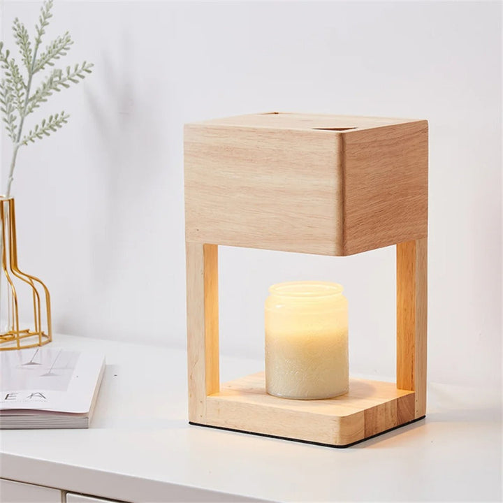 Natural wood candle warmer lamp on desk, minimalist Nordic style with jar candle