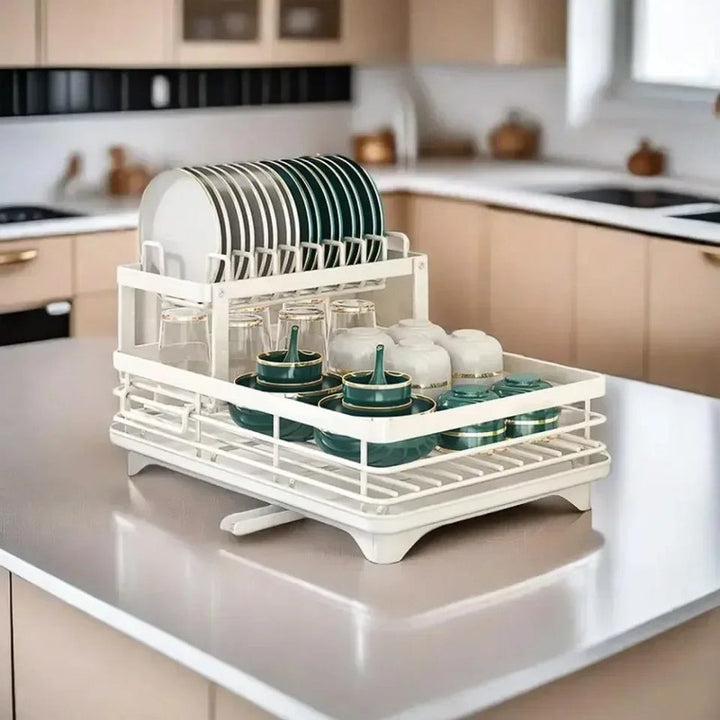 White dish rack with dishes on a kitchen counter
