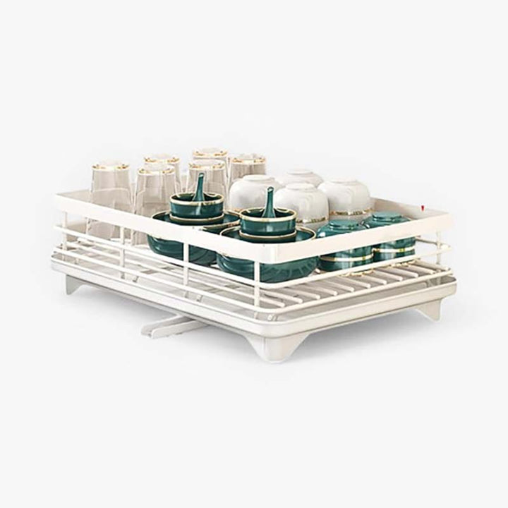 White dish rack with green bowls on a white background