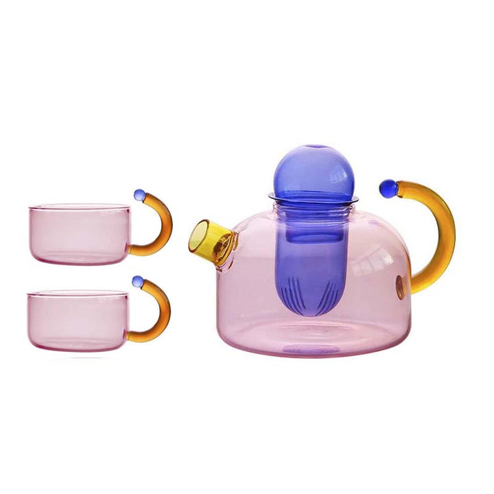 Colorful glass teapot and two cups on a white background