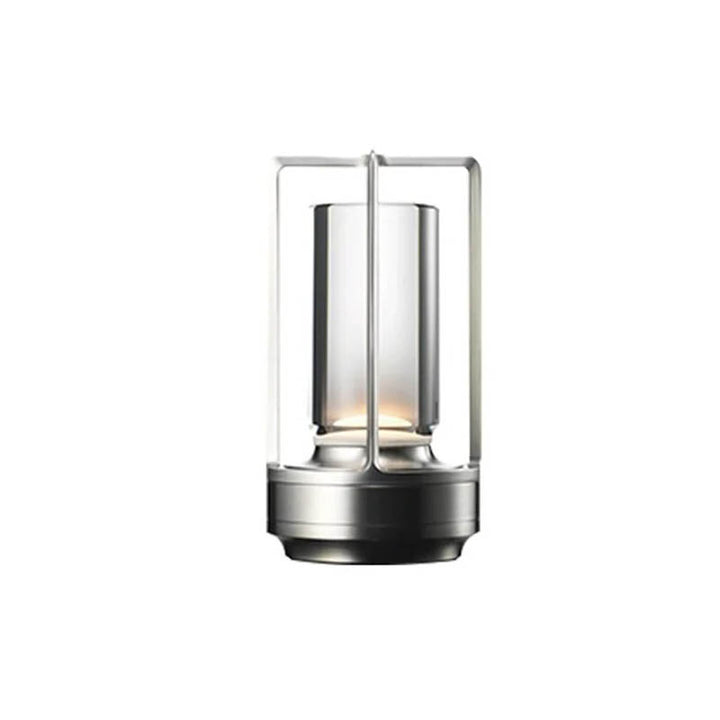 Silver LED cordless table lamp with sleek aluminium finish and modern cylindrical glass design.