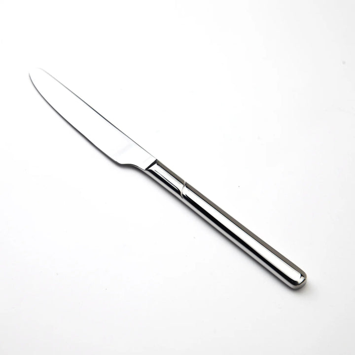 Stainless steel knife on a white background