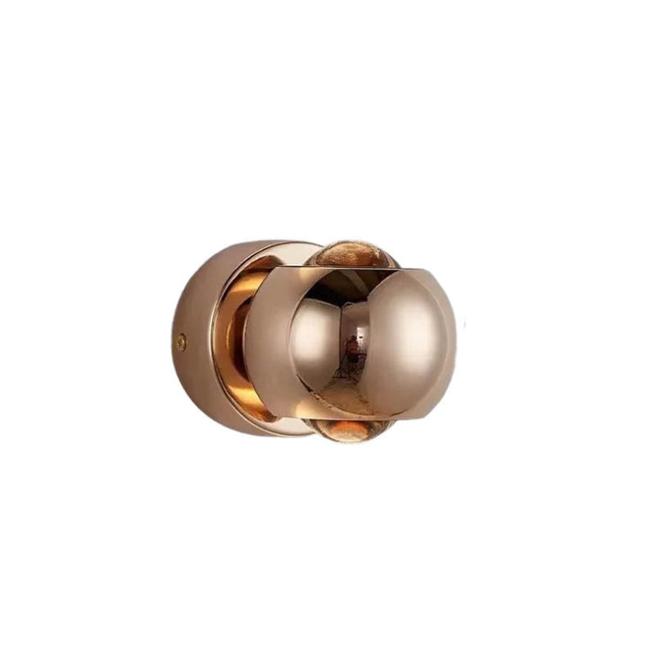 Gold rotatable LED wall light with dual-sided illumination, featuring a modern spherical design for contemporary interiors and accent lighting.