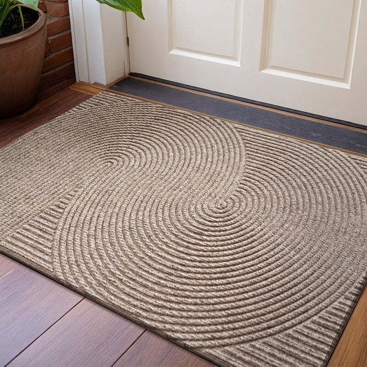 Beige circular 3D groove doormat placed at front entrance on wooden flooring, creating a warm and modern look.