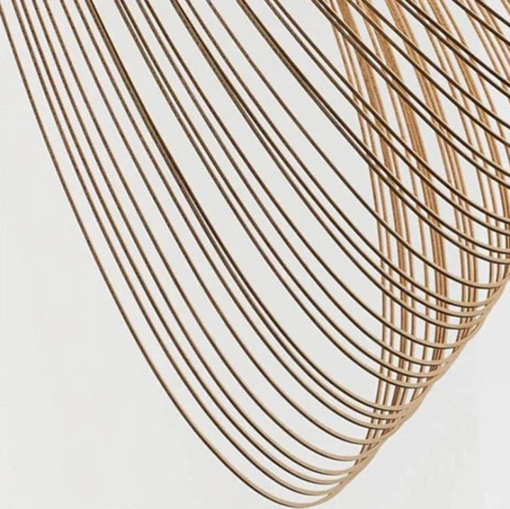 Detailed close-up of ENBIRK ceiling lamp, showing handcrafted beech wood spiral structure and fine craftsmanship.