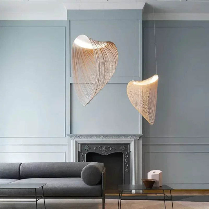 Set of two ENBIRK pendant lights hanging in Nordic grey living room, ideal for designer lounges or calm interiors.
