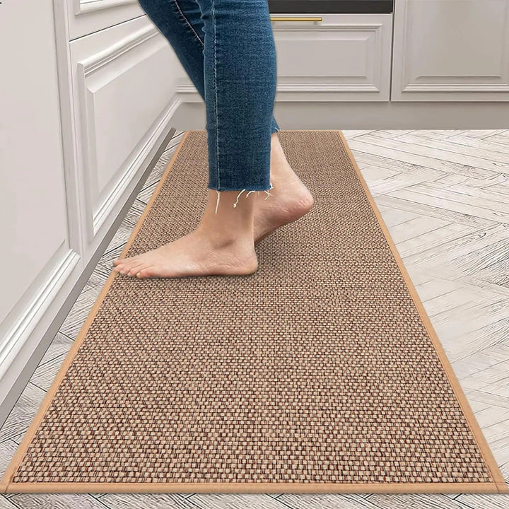 Person walking on a brown woven kitchen mat in a uk kitchen.