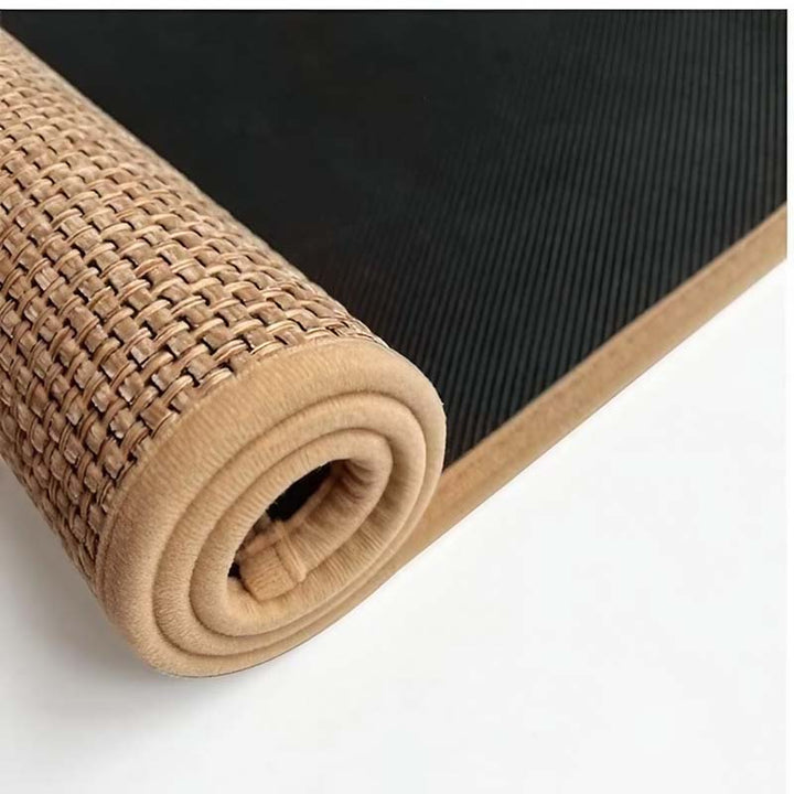 Rolled-up beige kitchen mat with textured surface on a white background