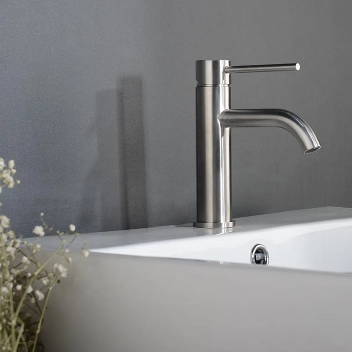 Brushed stainless steel basin mixer tap with curved spout, elegant and durable design.