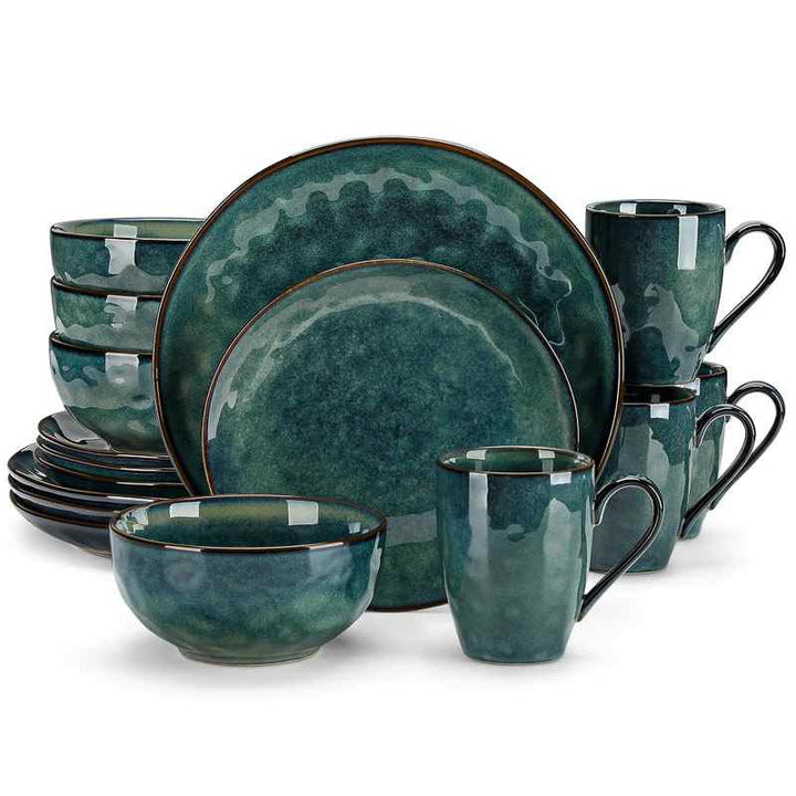 Set of teal ceramic dinnerware with black rims on a white background