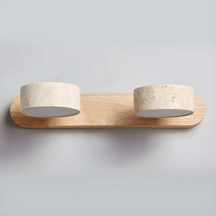 Wooden shelf with two circular stone bowls on a plain background
