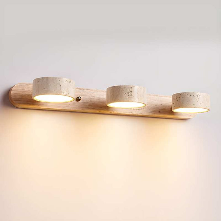 Three-light wall-mounted fixture with wooden finish on a light gray background