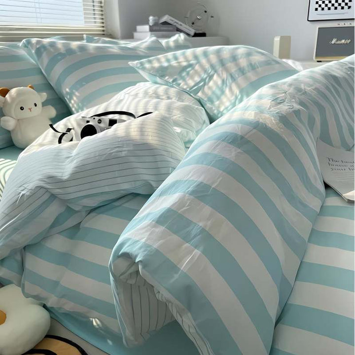 Aqua blue and white striped duvet cover set with pillowcases, clean Scandinavian bedroom look