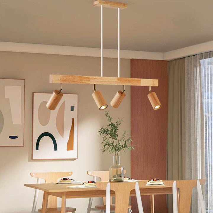 Dining room with a wooden pendant light fixture, table, chairs, and abstract art on the wall.