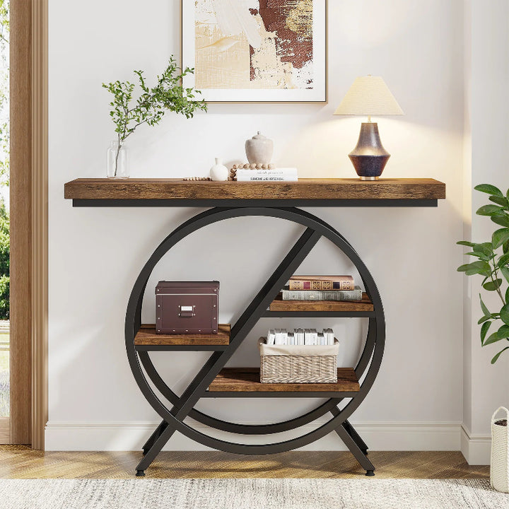 Console table with round metal base and wooden shelves against a white wall.