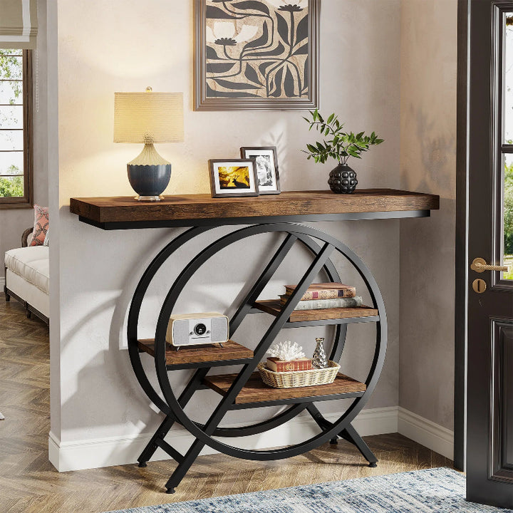 Console table with wooden top and circular metal base in a room setting.