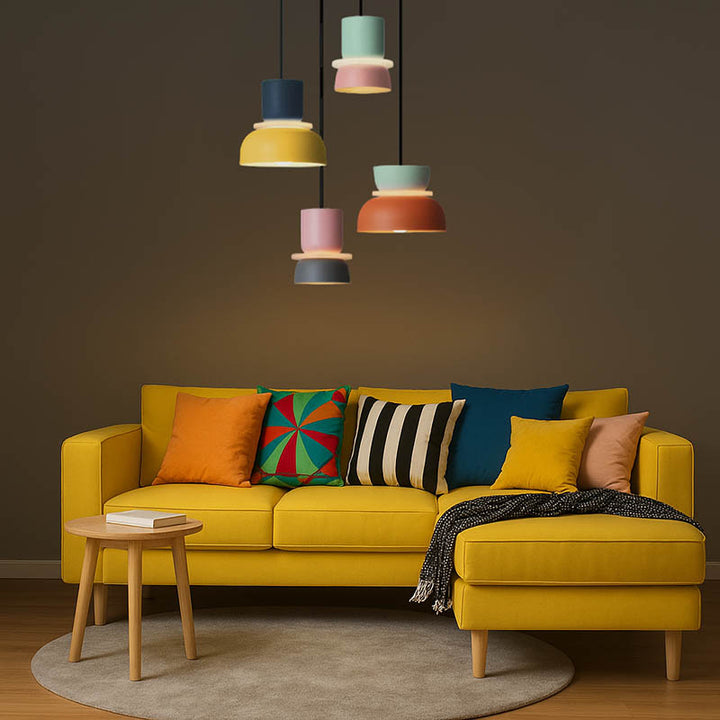 FARG pendant lights above yellow sofa in Nordic UK living room, with colourful shades and dimmable LED lighting.