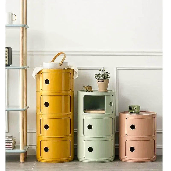 Colorful modular bedside cabinet with a modern design, featuring multiple storage compartments, a sturdy frame, and a vibrant finish for stylish organization.