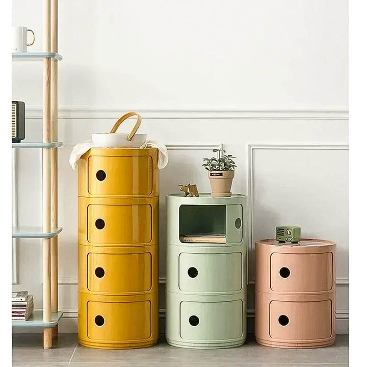 Colorful modular bedside cabinet with a modern design, featuring multiple storage compartments, a sturdy frame, and a vibrant finish for stylish organization.