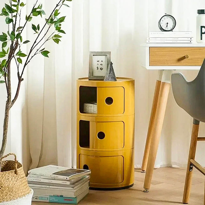 Colorful modular bedside cabinet with a modern design, featuring multiple storage compartments, a sturdy frame, and a vibrant finish for stylish organization.