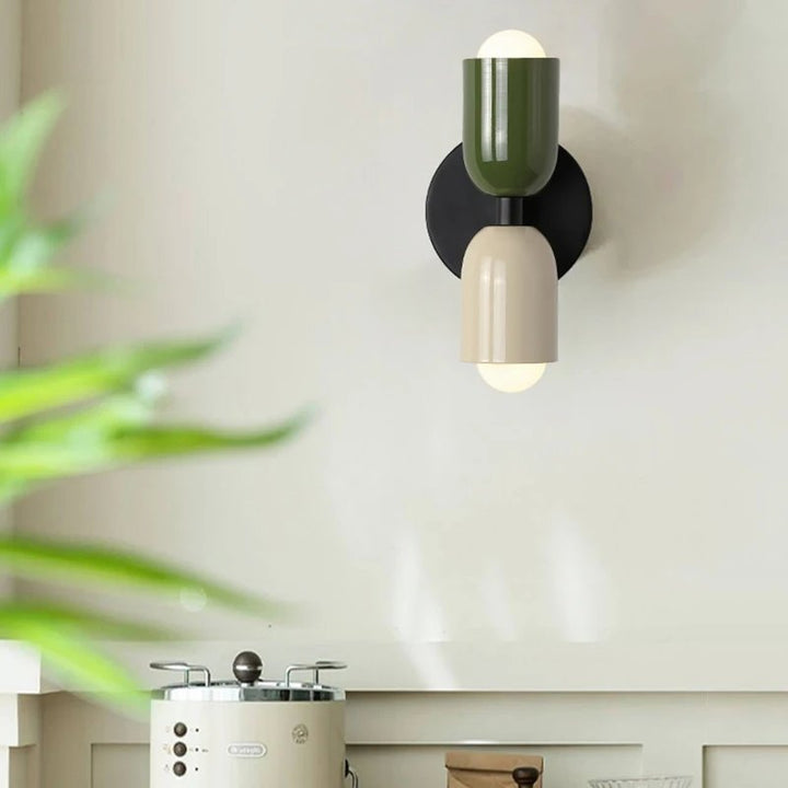 Close-up of FARVERIG Glow wall light showing dual adjustable LED heads and sleek matte black finish 