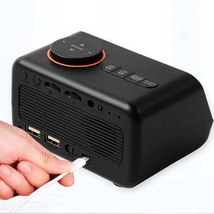 Black FM Radio LED Alarm Clock rear view showing dual USB ports, power input, and control buttons while charging.