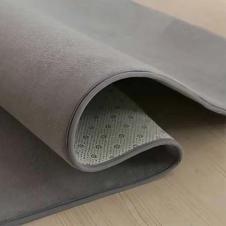Gray rug on a wooden floor