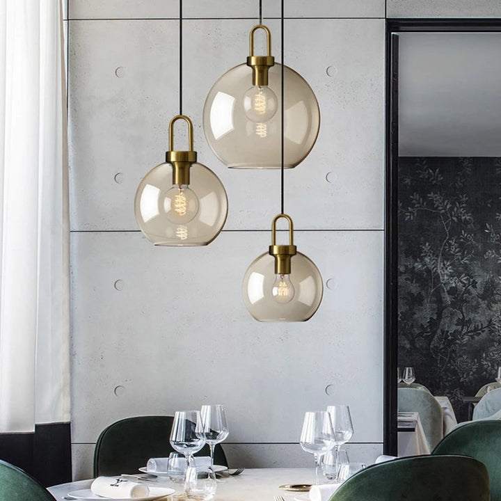 GLASSET Collection industrial glass pendant lamp with a sleek metal frame, modern design, and warm LED lighting for kitchen or dining room.