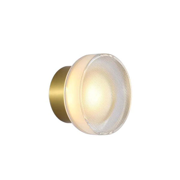 Modern glass wall sconce with gold aluminium base and stained glass diffuser, ideal for Nordic accent lighting.