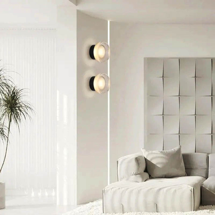 ILD stained glass wall lights in modern bedroom with upholstered wall panel, soft ambient glow for luxury interiors.