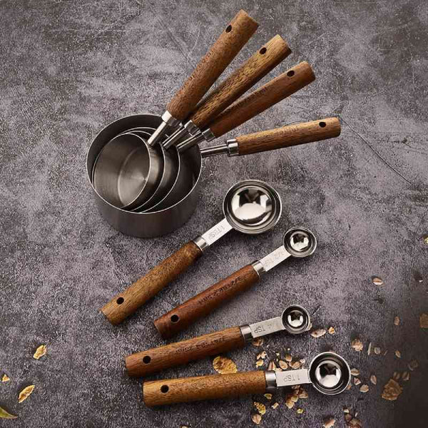 Silver stainless steel & wood measuring spoon set, durable kitchen tools for cooking.