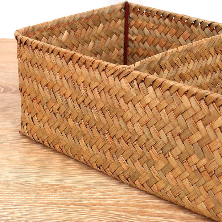 Close-up of rectangular wicker organiser with 3 compartments, natural tone, perfect for storing toiletries or small items.
