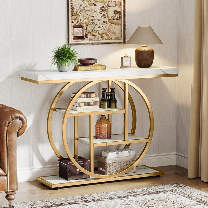 Decorative console table with gold circular design in a room setting.
