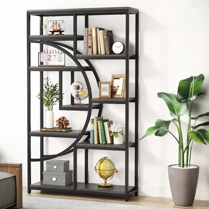 Black metal bookshelf with decorative items against a white wall