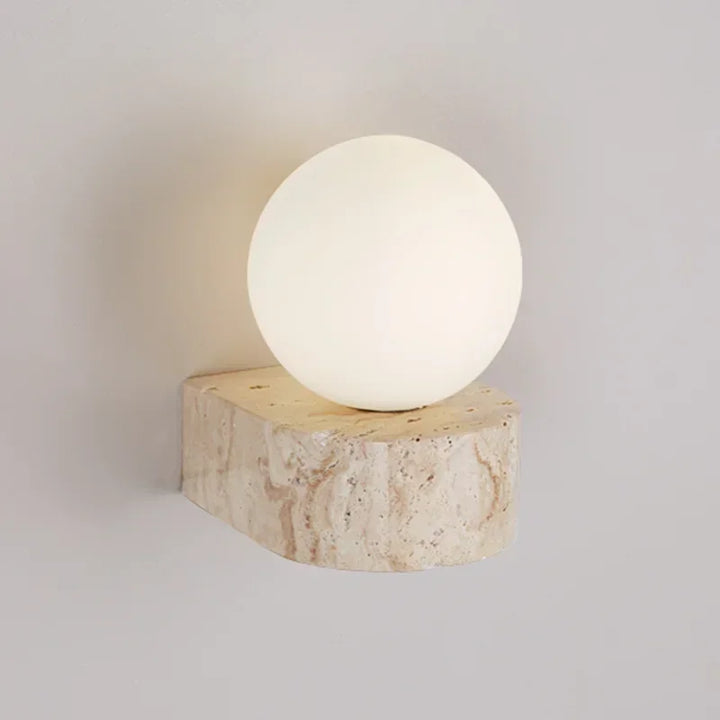 KLOT wall lamp with round frosted glass globe on yellow travertine stone base