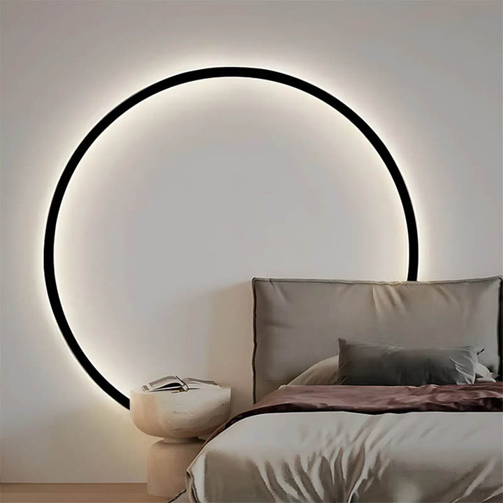 Scandinavian bedroom with 60cm KRETS ring LED wall light casting a soft ambient halo effect