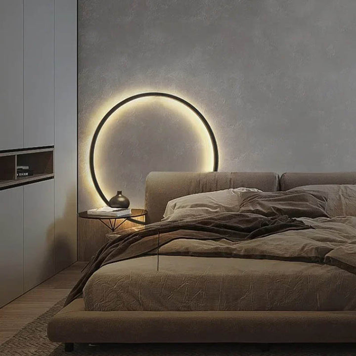 Modern Nordic bedroom featuring a 31.5in KRETS ring LED wall lamp with ambient backlighting