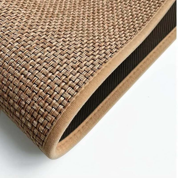 Close-up of a woven kitchen mat with a textured surface on a white background