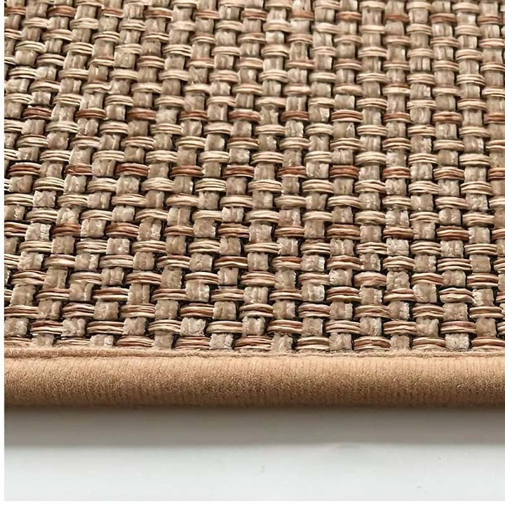 Close-up of a woven kitchen  mat with a textured pattern on a white background